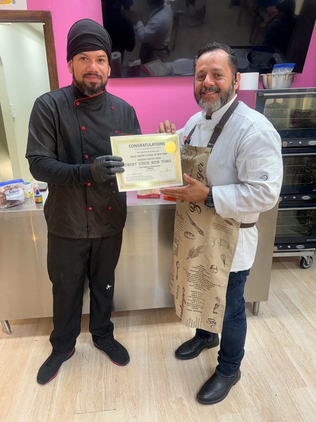 Receiving the certificate from the Magic Bakery School of New York